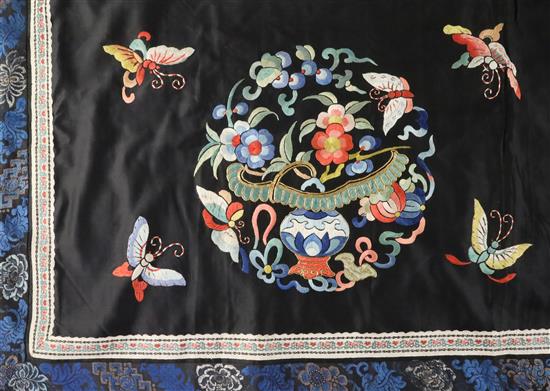 A Chinese embroidered black satin table frontal, late Qing dynasty, 211 x 56cm